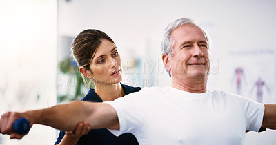 Buy stock photo Physical therapy, exercise and physiotherapist with a senior man helping him heal at a rehabilitation clinic. Healthcare, wellness and elderly guy doing a workout with weights in physiotherapy class.
