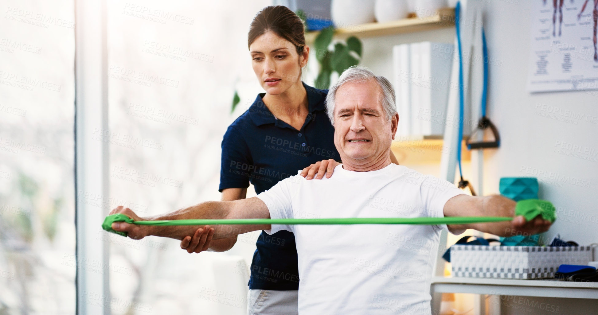 Buy stock photo Physiotherapy, senior man and doctor exercise, resistance band and workout for muscle rehabilitation in a clinic.  Physiotherapist, elderly patient and training, stretching muscles and body fitness