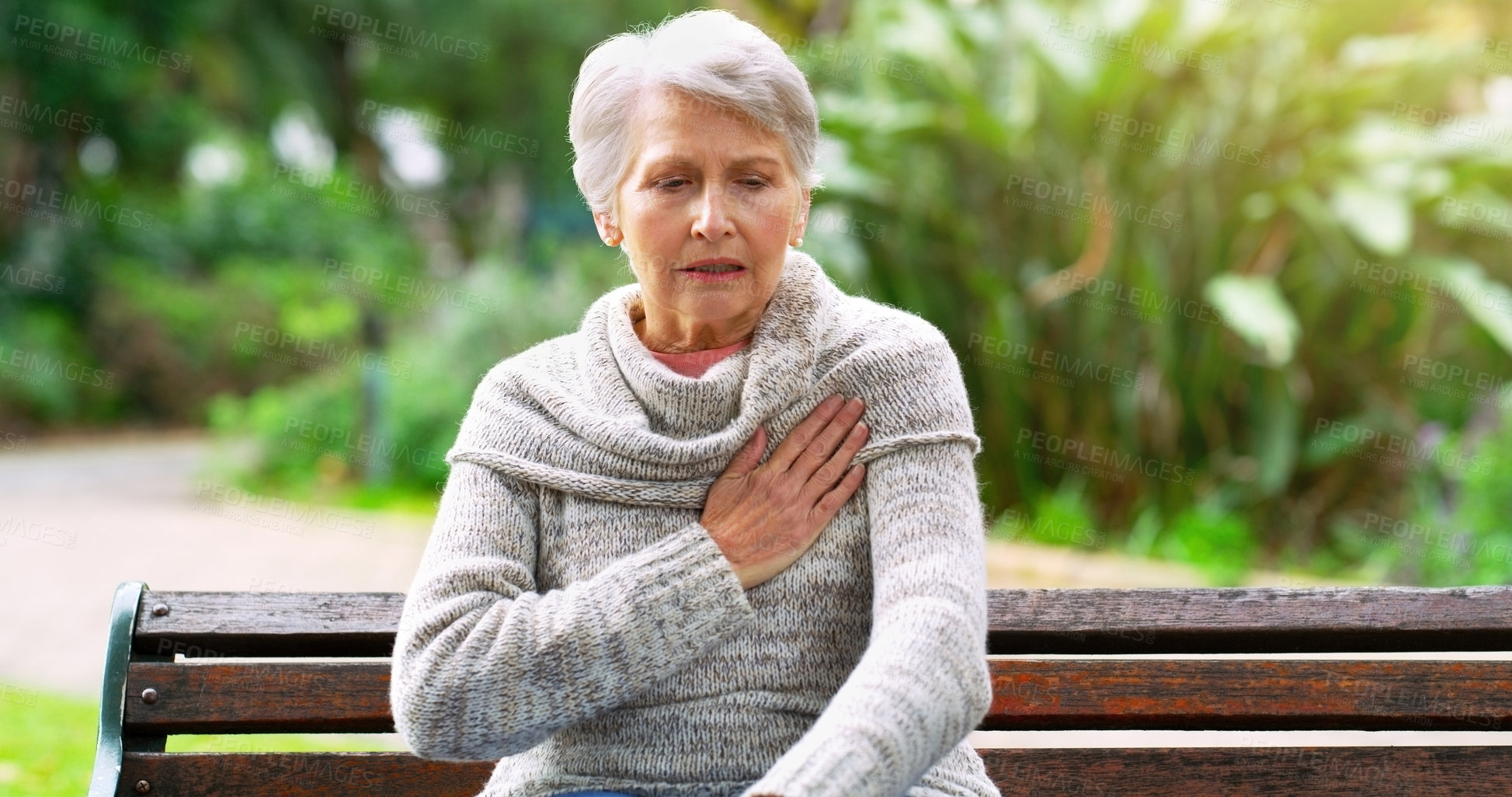 Buy stock photo Senior woman, heart attack and pain in park, pneumonia and cardiac risk or hypertension in nature. Female person, heartburn and stress on lungs or bench, stroke and danger of healthcare or disease