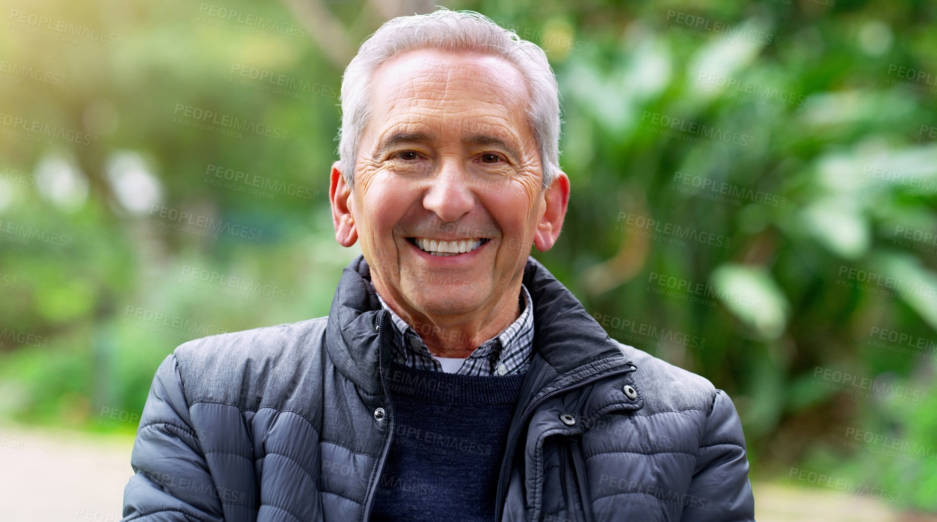 Buy stock photo Portrait, smile and elderly man in garden or park for leisure, outdoor recreation and retirement. Face, flare and green with happy senior person in nature to relax for summer wellbeing or wellness