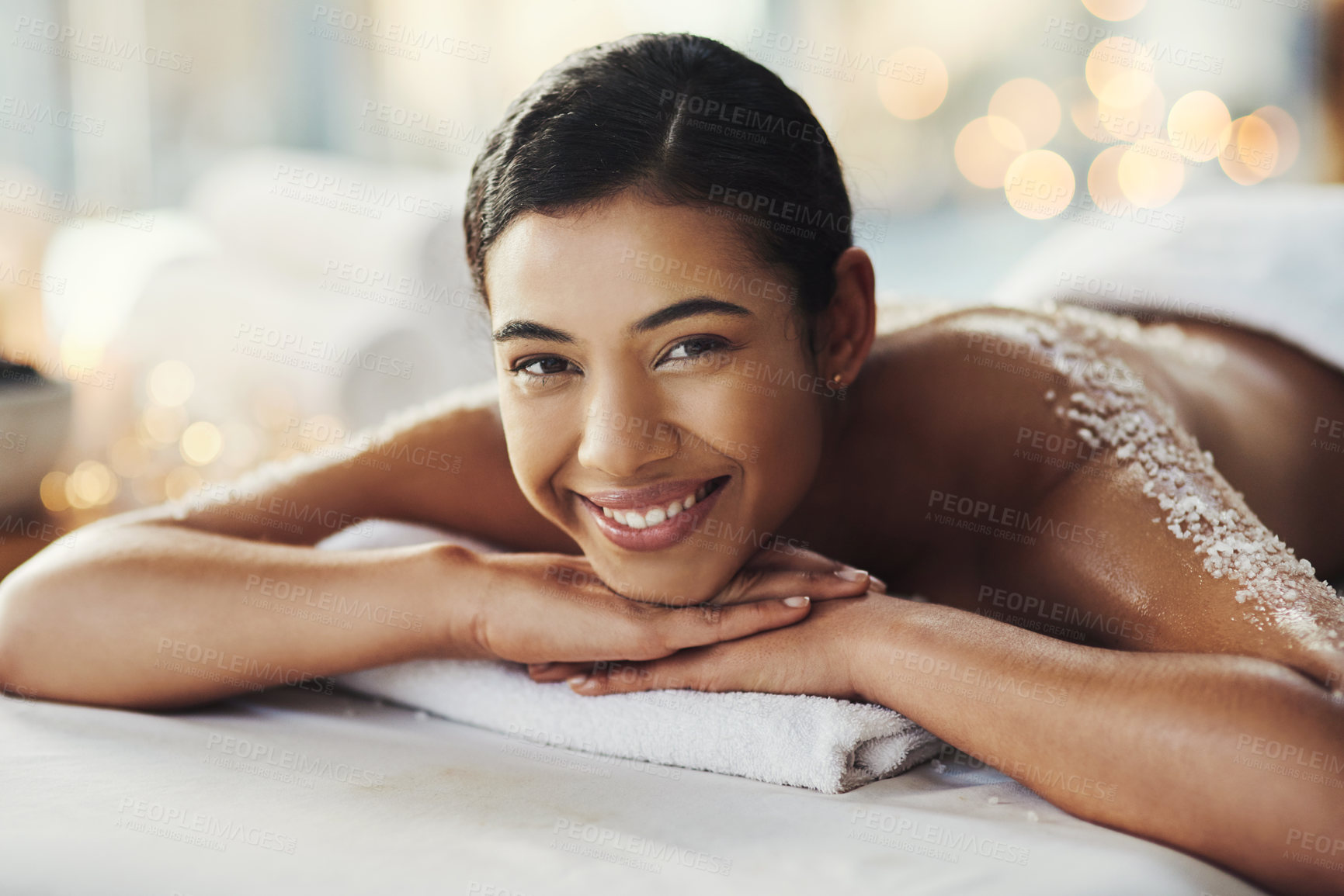 Buy stock photo Happy woman, face and portrait at spa for massage, skincare or beauty in relax body treatment. Calm female lying in relaxation on bed with smile for back exfoliation, zen therapy or wellness at salon