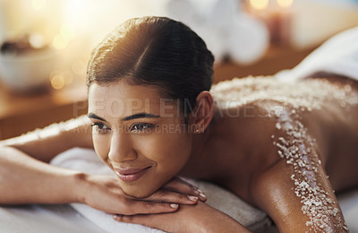 Buy stock photo Shot of a young woman getting an exfoliating massage at a spa