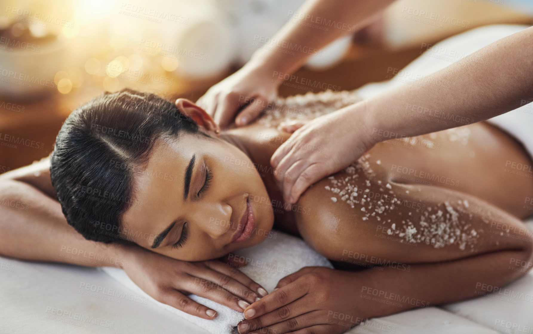 Buy stock photo Happy woman, hands and salt scrub in back massage at spa in relax for skincare, exfoliation or body treatment. Calm female smiling in relaxation for therapy, health or zen with masseuse at salon