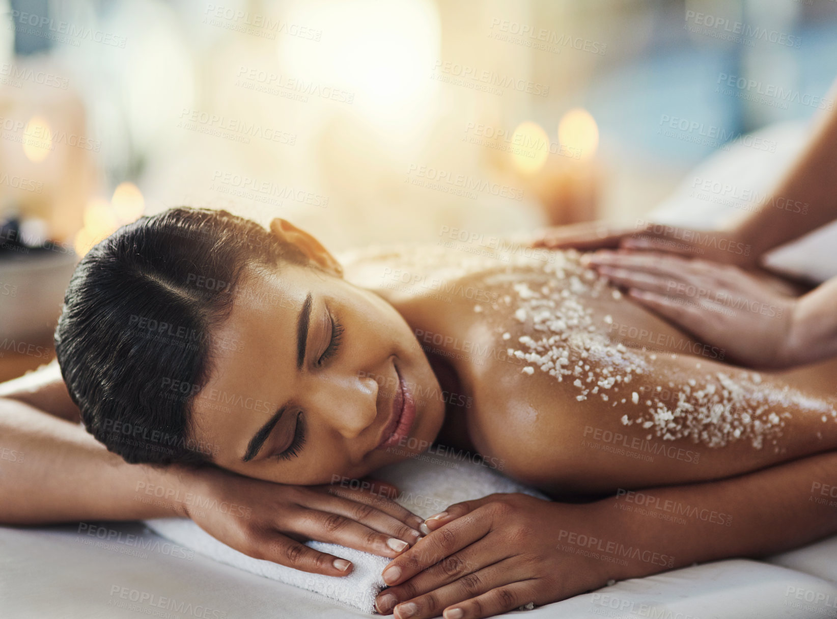 Buy stock photo Happy woman, salt scrub and massage back at spa to relax for skincare, exfoliation or self care. Female person, beauty and smile for luxury body treatment, health and wellness with masseuse at salon