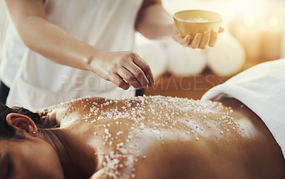 Buy stock photo Woman, hands and salt in massage at spa for skincare, exfoliation or body treatment at resort. Hand of masseuse applying salts to back skin for relaxation, therapy or zen in healthy wellness at salon