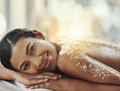 Buy stock photo Happy woman, portrait and relax at spa in salt scrub for body treatment, skincare or massage at resort. Calm female face lying on bed in relaxation with smile for exfoliation, zen or therapy at salon