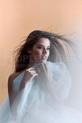 Buy stock photo Thinking, girl and confident with fashion in studio of cosmetics, stylish clothes and elegant aesthetic. Proud, woman and wind of outfit material, glamour makeup and allure beauty on brown background