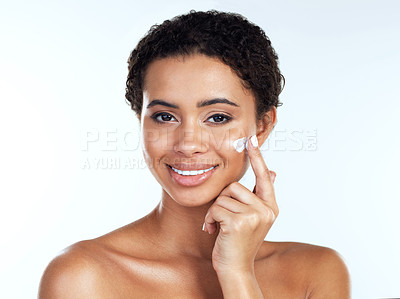 Buy stock photo Woman, portrait and moisturizing cream in studio, apply facial treatment and white background. Female person, cosmetics and lotion for skincare or smooth skin, hydration and dermatology sunscreen