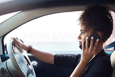 Buy stock photo Cropped shot of an attractive young businesswoman taking a phonecall while driving her car