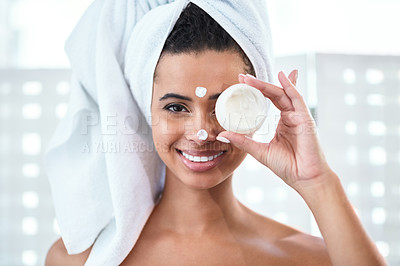Buy stock photo Cropped shot of a young woman holding a beauty product over her eye