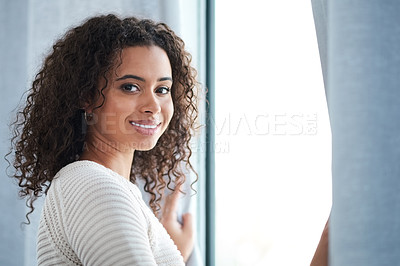 Buy stock photo Cropped shot of a beautiful young woman spending the day at home
