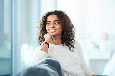 Buy stock photo Cropped shot of a beautiful young woman spending the day at home