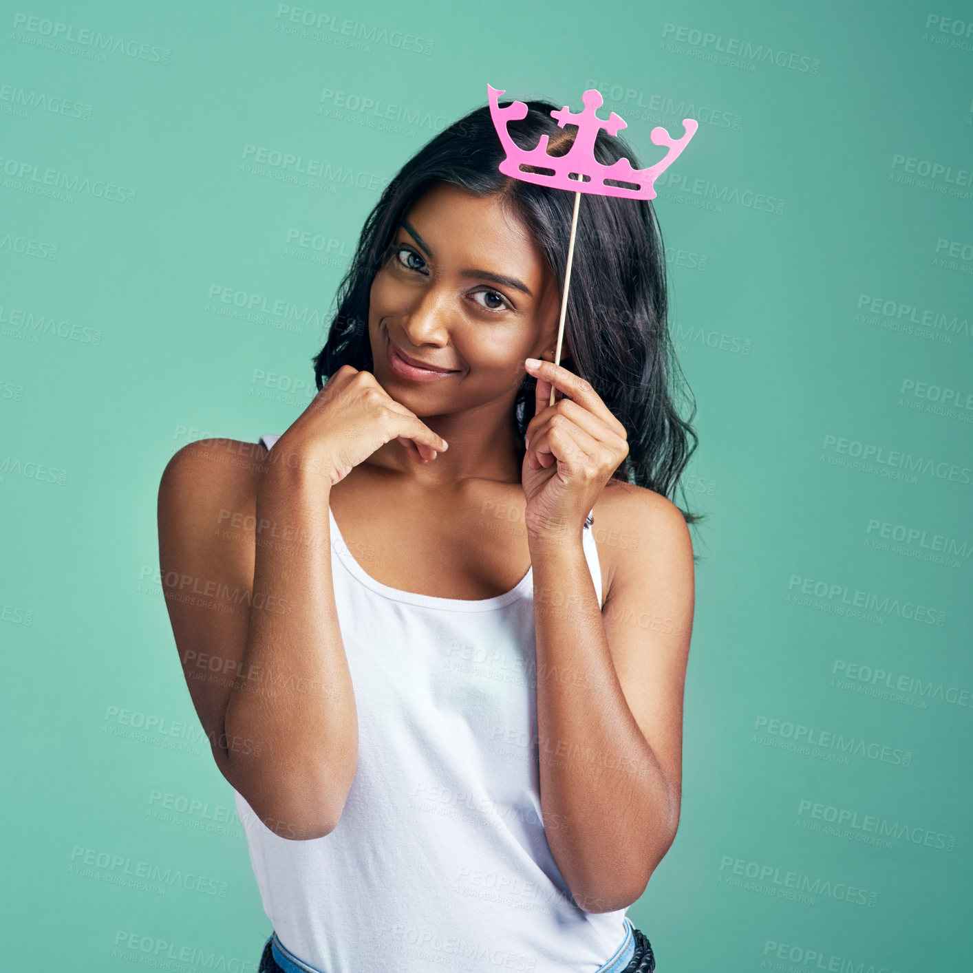 Buy stock photo Girl, portrait and crown birthday in studio as gen z on green background for fashion, style and fun. Female person, happiness and celebration in playful, aesthetic or mockup for creativity or freedom