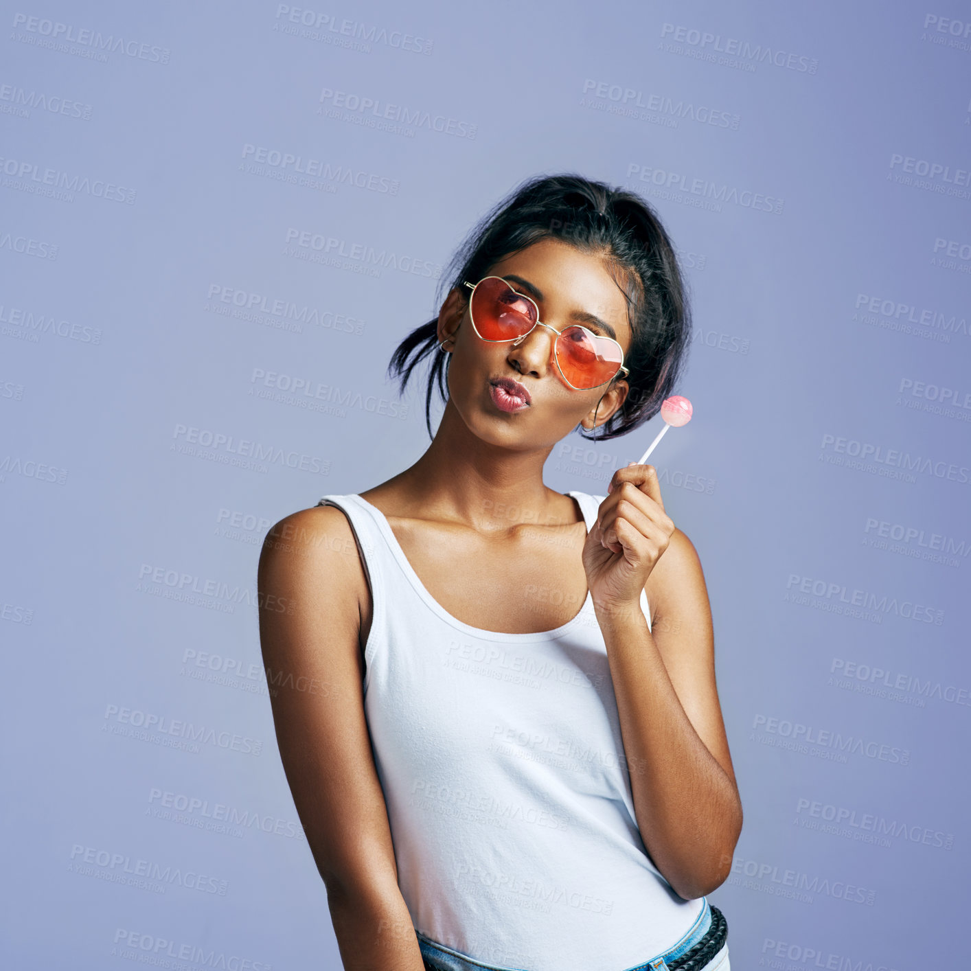 Buy stock photo Girl, lollipop and pouting with sunglasses in studio on purple  background in casual, style and elegant. Portrait, fashion and smile with thinking for eyewear or street wear, outfit and confident