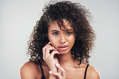 Buy stock photo Portrait, woman and beauty in studio for skincare, natural and cosmetic on white background. Curly hair, cosmetology and facial treatment for serious model person, hands and texture for haircare