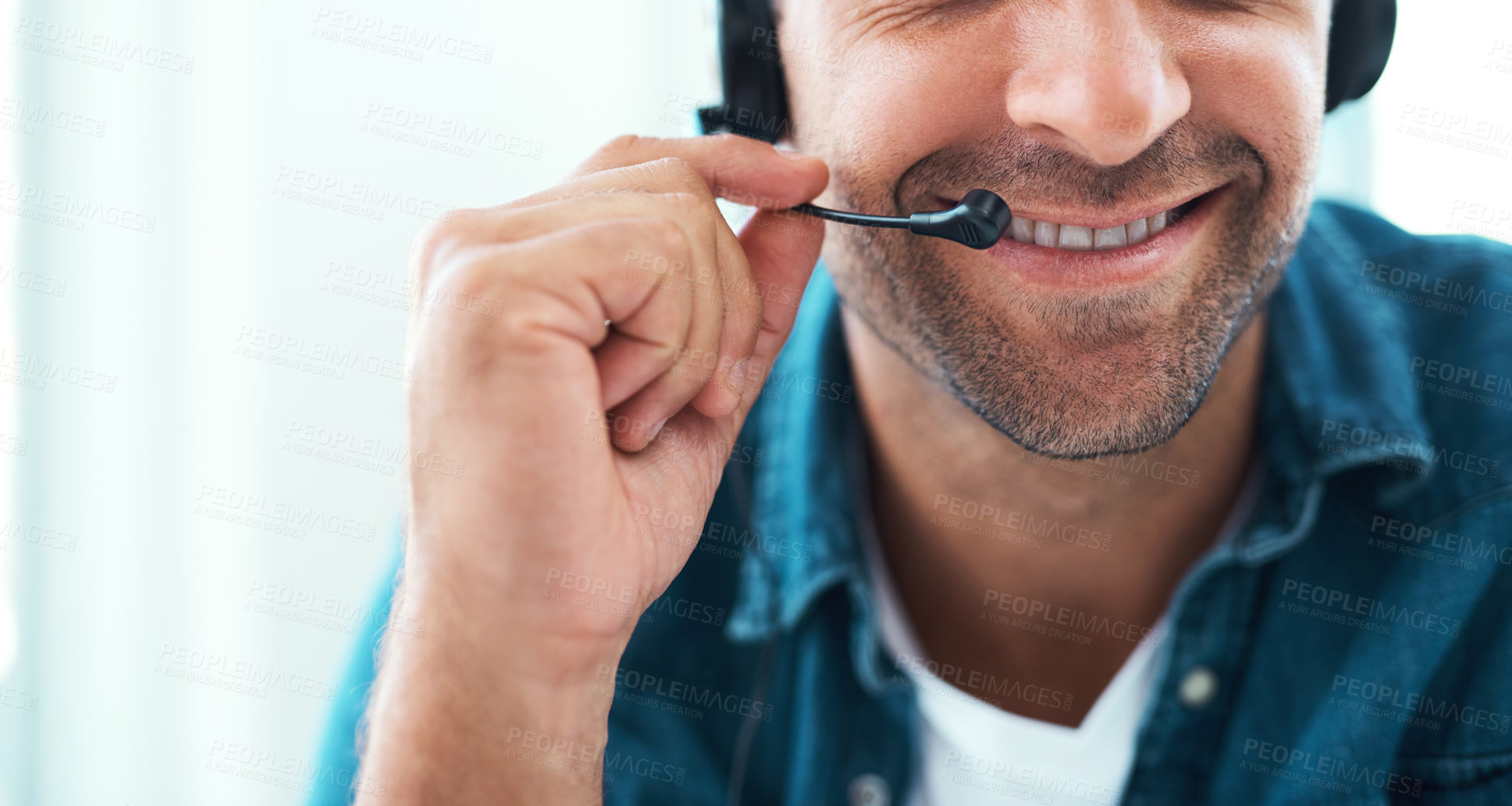 Buy stock photo Shot of an unrecognizable call centre agent working in his office