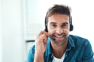 Buy stock photo Portrait of an attractive young call centre agent working in his office