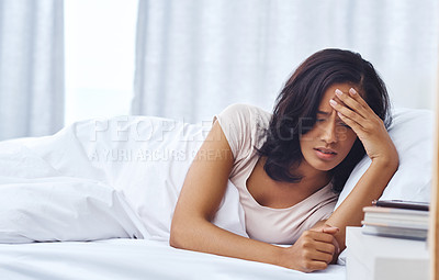 Buy stock photo Shot of a young woman feeling unwell in the morning at home