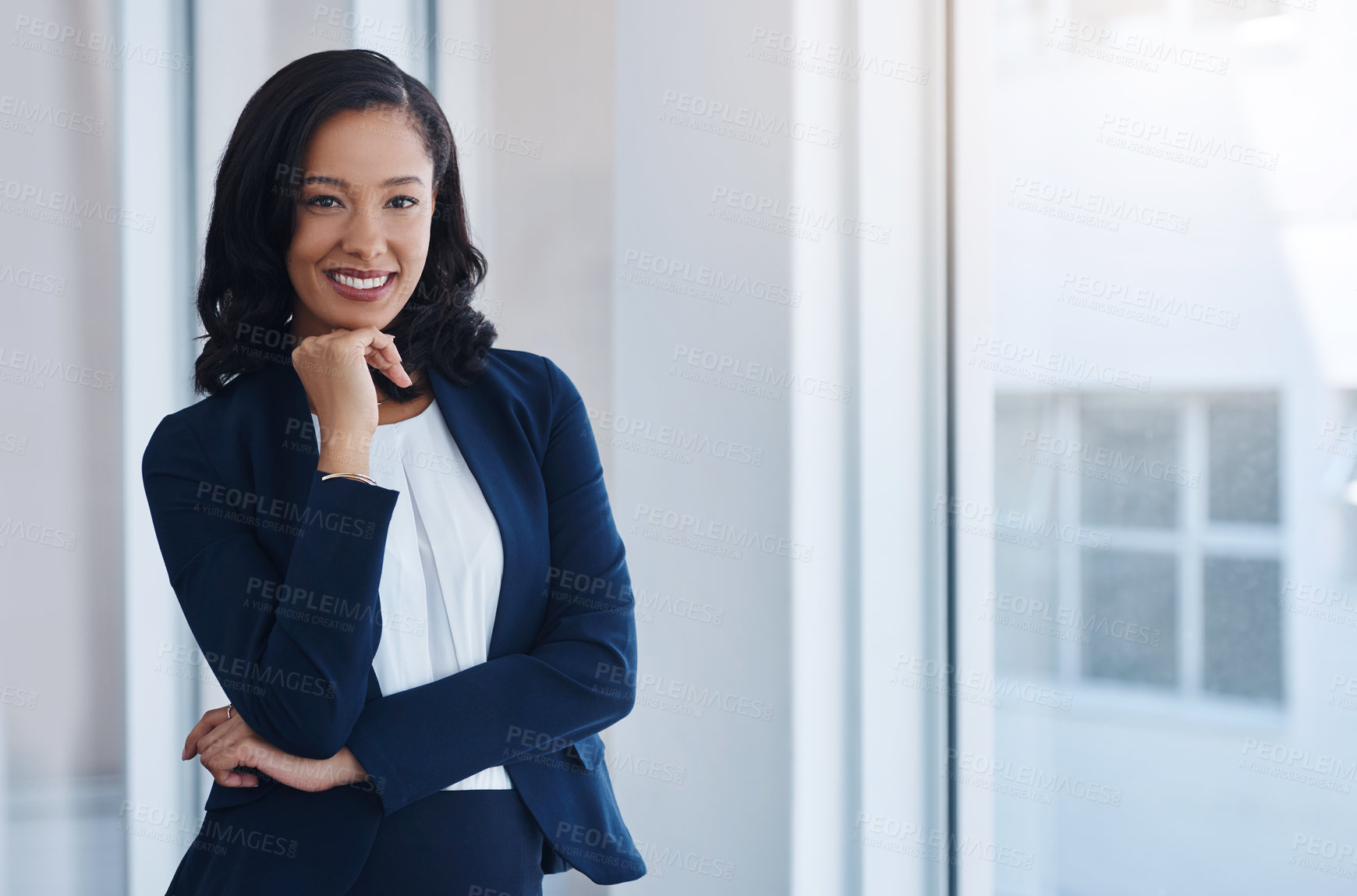 Buy stock photo Portrait of a confident young businesswoman standing in an office