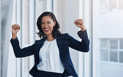 Buy stock photo Shot of a young businesswoman cheering in an office