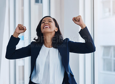 Buy stock photo Shot of a young businesswoman cheering in an office