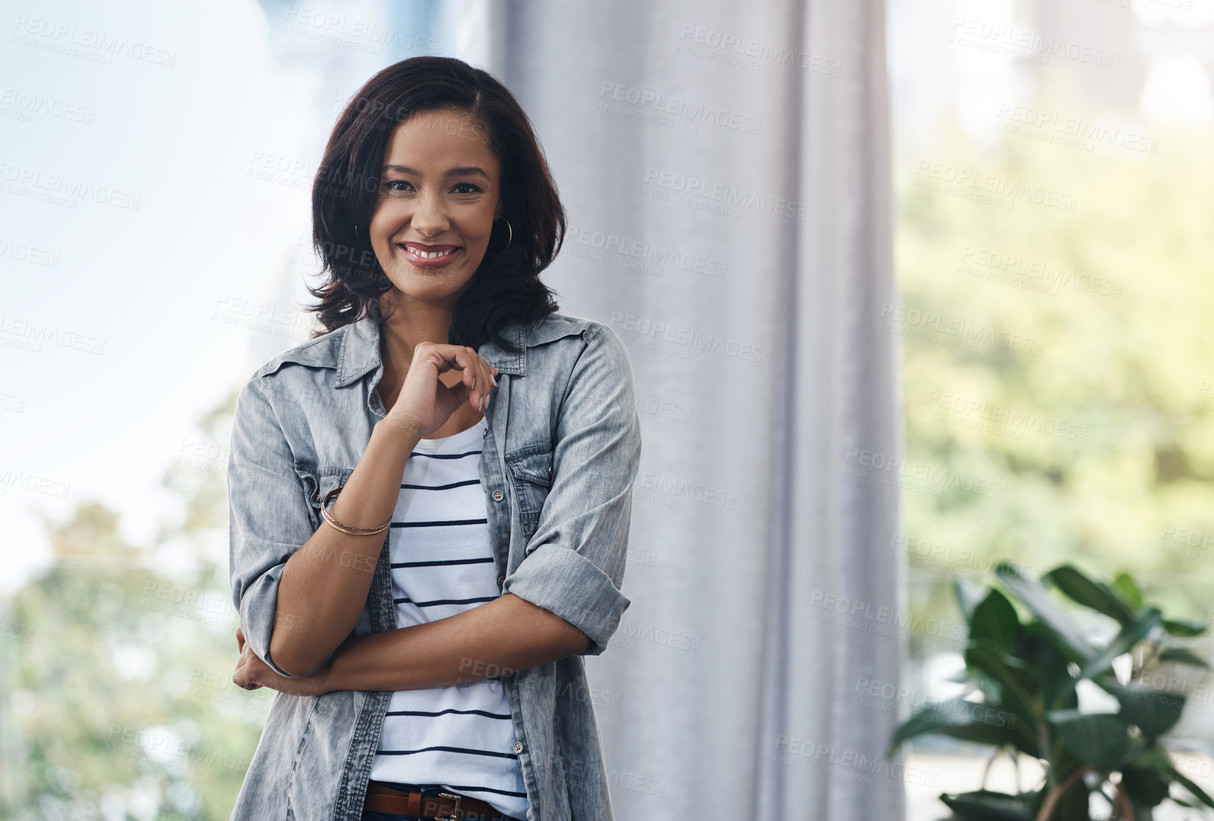 Buy stock photo Portrait of a young woman relaxing at home