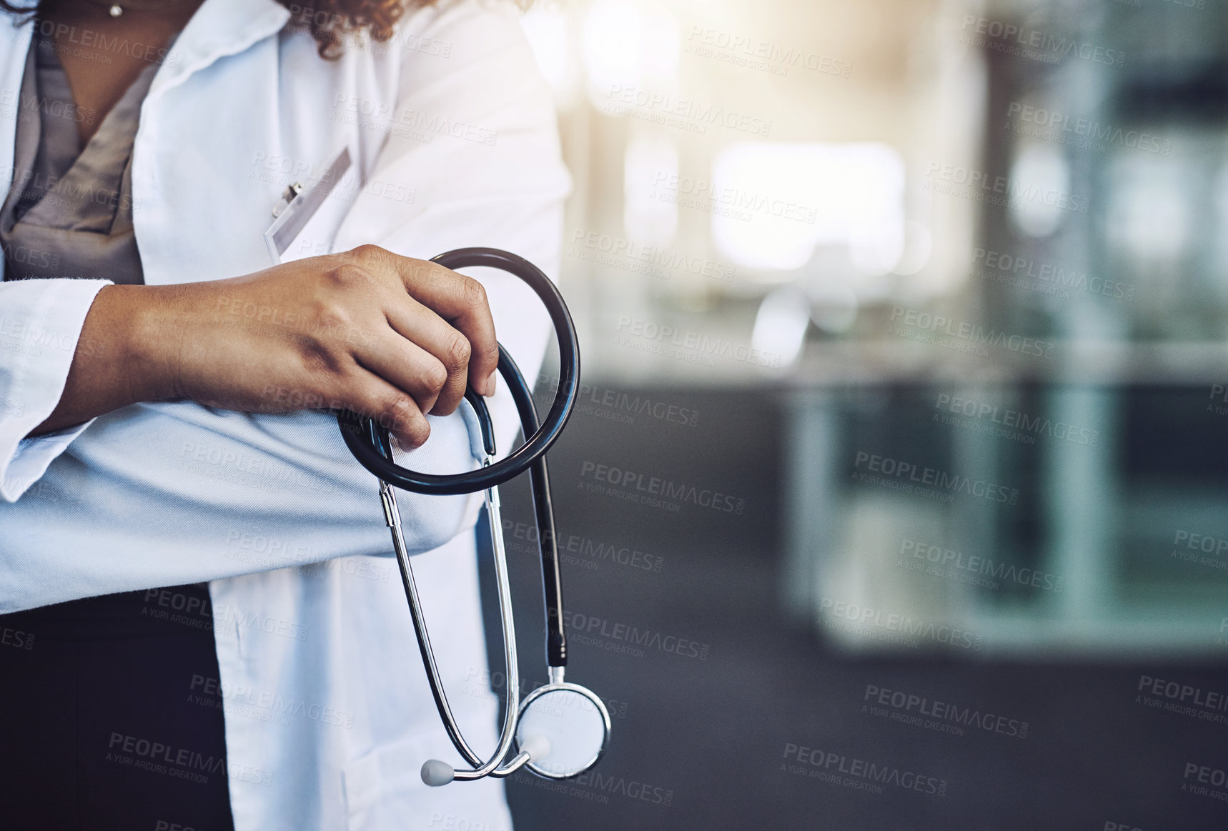 Buy stock photo Cropped shot of an unrecognizable doctor holding s stethoscope