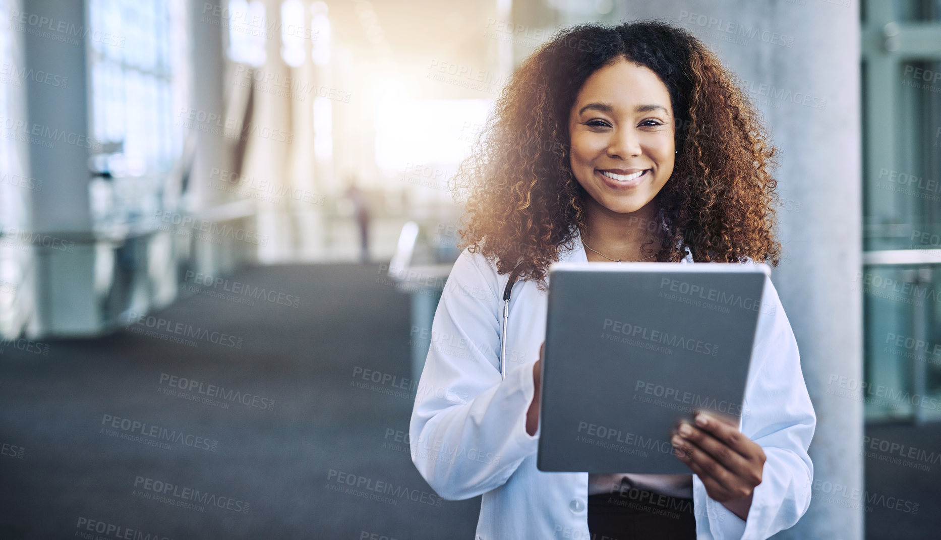 Buy stock photo Shot of a female doctor using a digital tablet