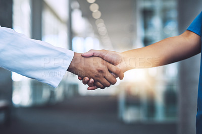 Buy stock photo Closeup shot of two medical practitioners shaking hands