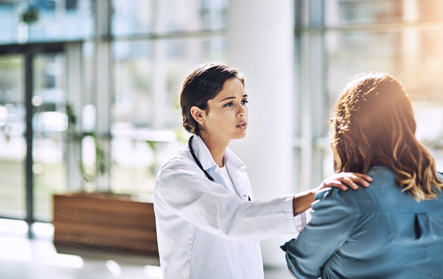 Buy stock photo Cropped shot of a female doctor talking to a patient