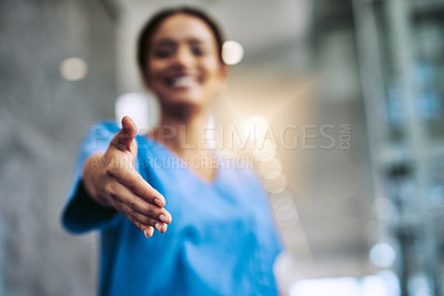 Buy stock photo Cropped shot of a female nurse reaching for a handshake