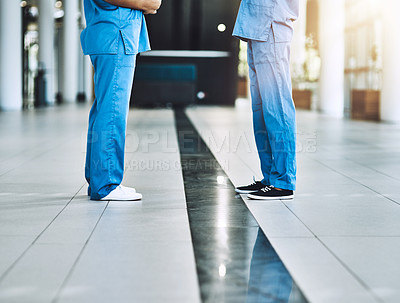 Buy stock photo Cropped shot of two medical practitioners having a discussion in a hospital