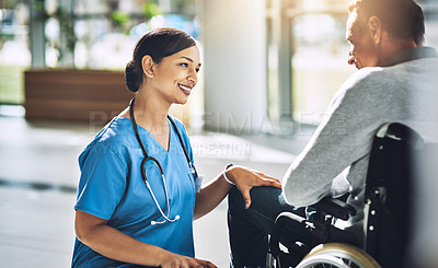 Buy stock photo Shot of a friendly medical practitioner assisting a handicapped patient