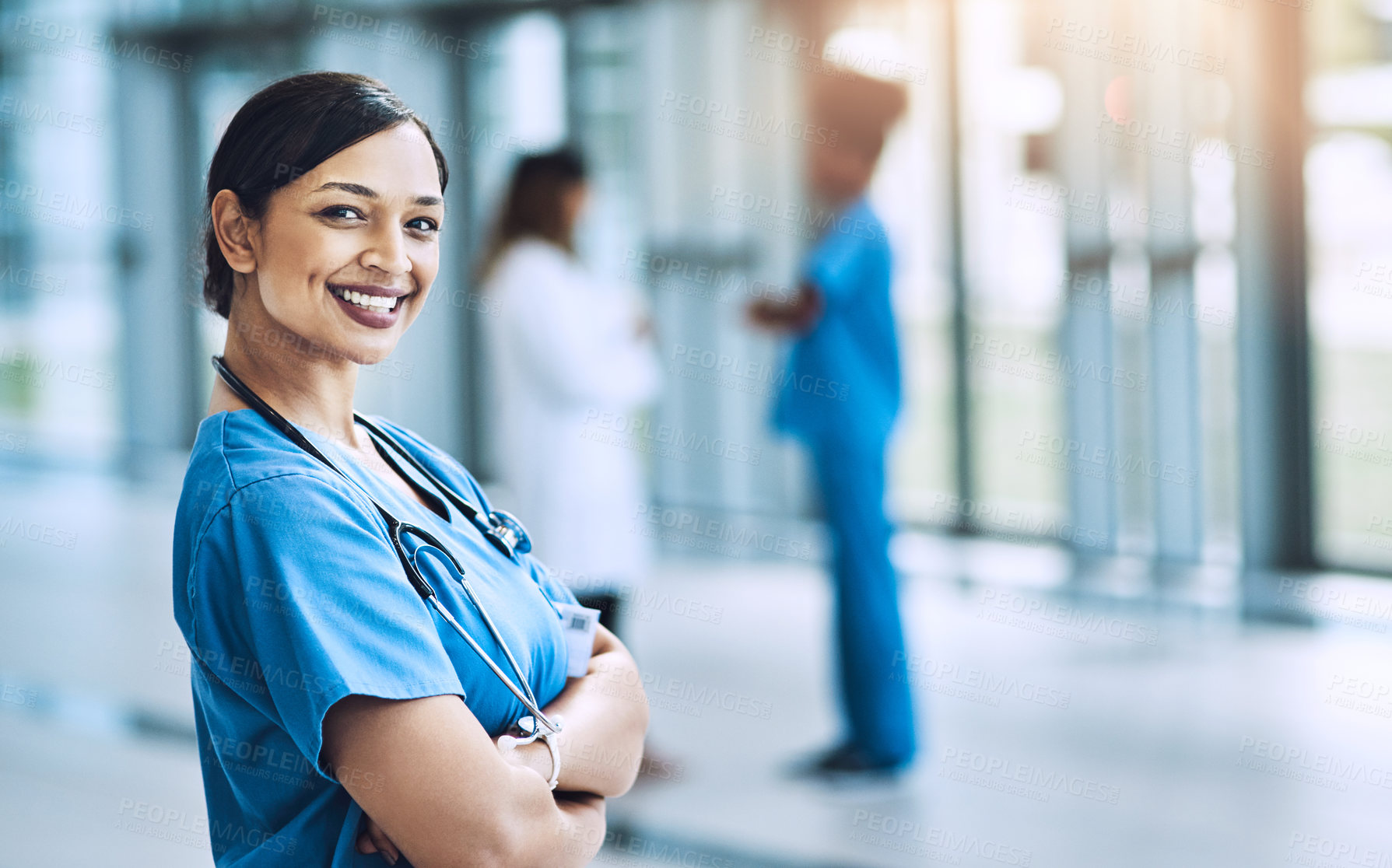 Buy stock photo Cropped shot of a female nurse standing in a hospital