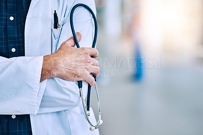 Buy stock photo Healthcare, crossed arms and closeup of a doctor with a stethoscope in a hospital with mockup space. Career, professional and zoom of a male medical worker hand with equipment in a medicare clinic.