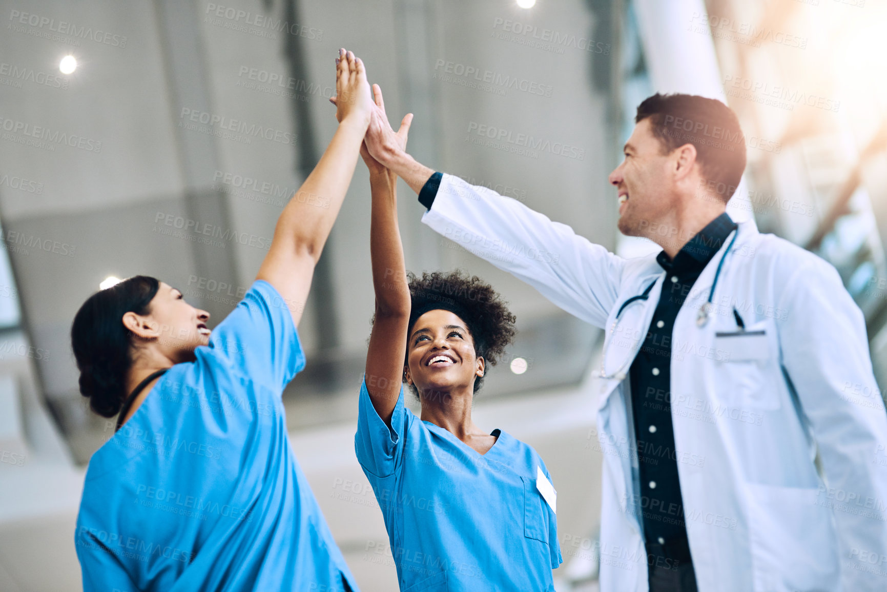 Buy stock photo High five, doctors and smile for celebration, team unity and celebrate medical goals in clinic. Healthcare, happy group and people join hands for success, support and collaboration of diversity