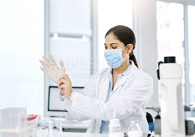 Buy stock photo Woman, gloves and mask in lab for safety, protection and standard procedure in healthcare. Scientist, PPE and preparation in clinic for medical research, vaccine development and pharmaceutical study