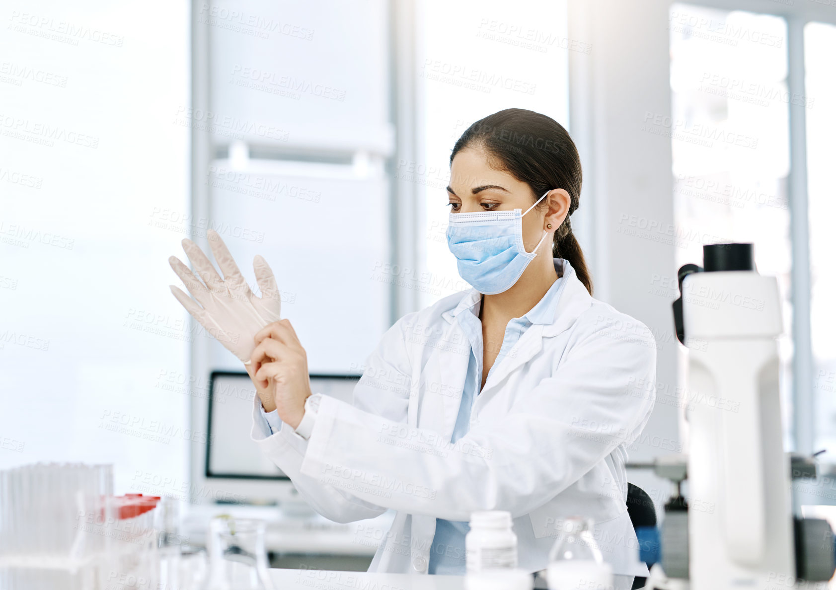 Buy stock photo Woman, gloves and mask in lab for safety, protection and standard procedure in healthcare. Scientist, PPE and preparation in clinic for medical research, vaccine development and pharmaceutical study