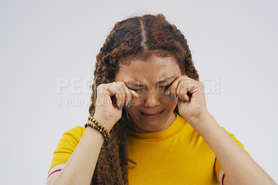 Buy stock photo Crying, broken heart and girl in studio with depression, crisis and stress on grey background in pain. Gen z, sorrow and emotional woman frustrated by worry, anxiety and grief with loss and bad news