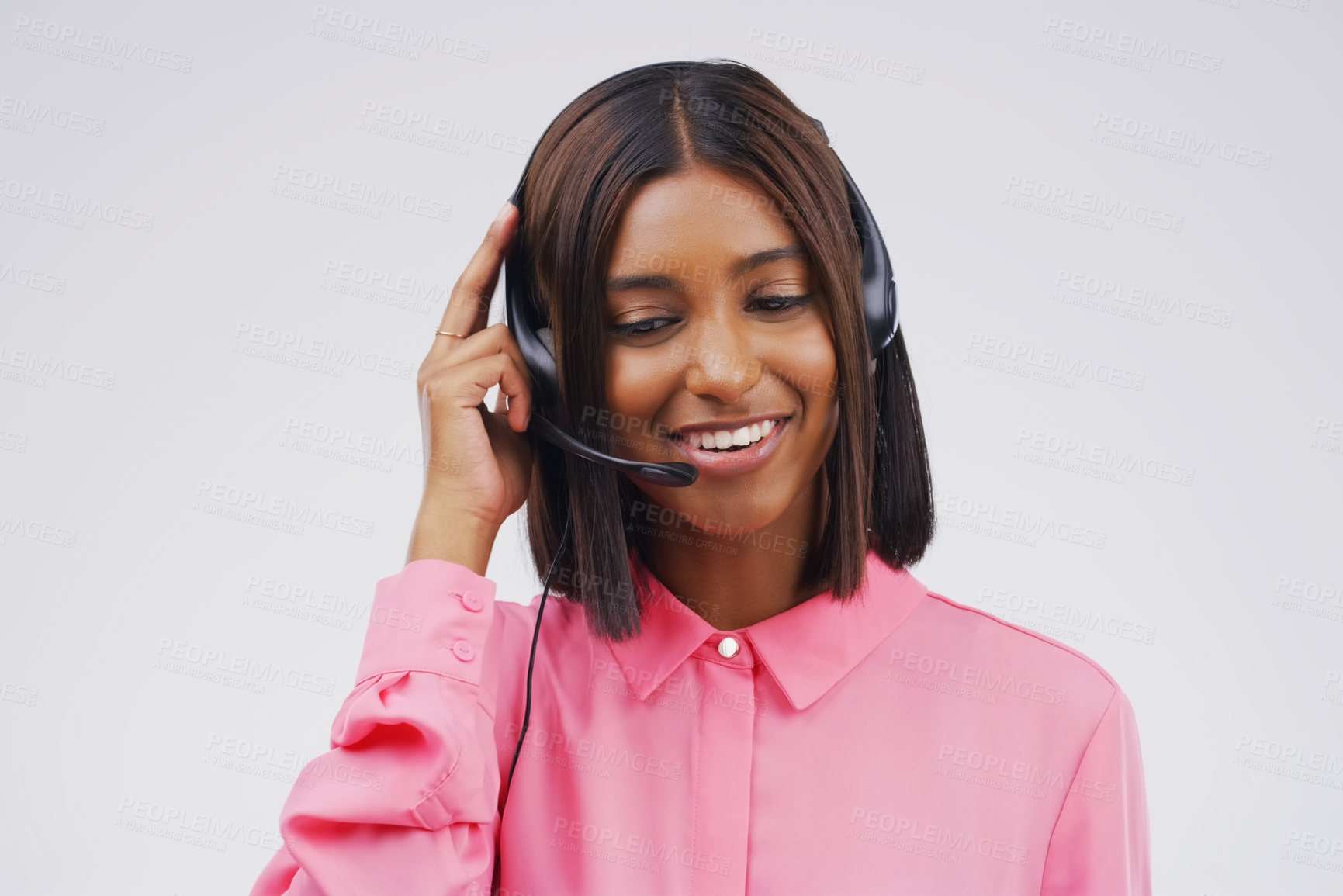 Buy stock photo Studio shot of an attractive young female customer service representative wearing a headset against a grey background