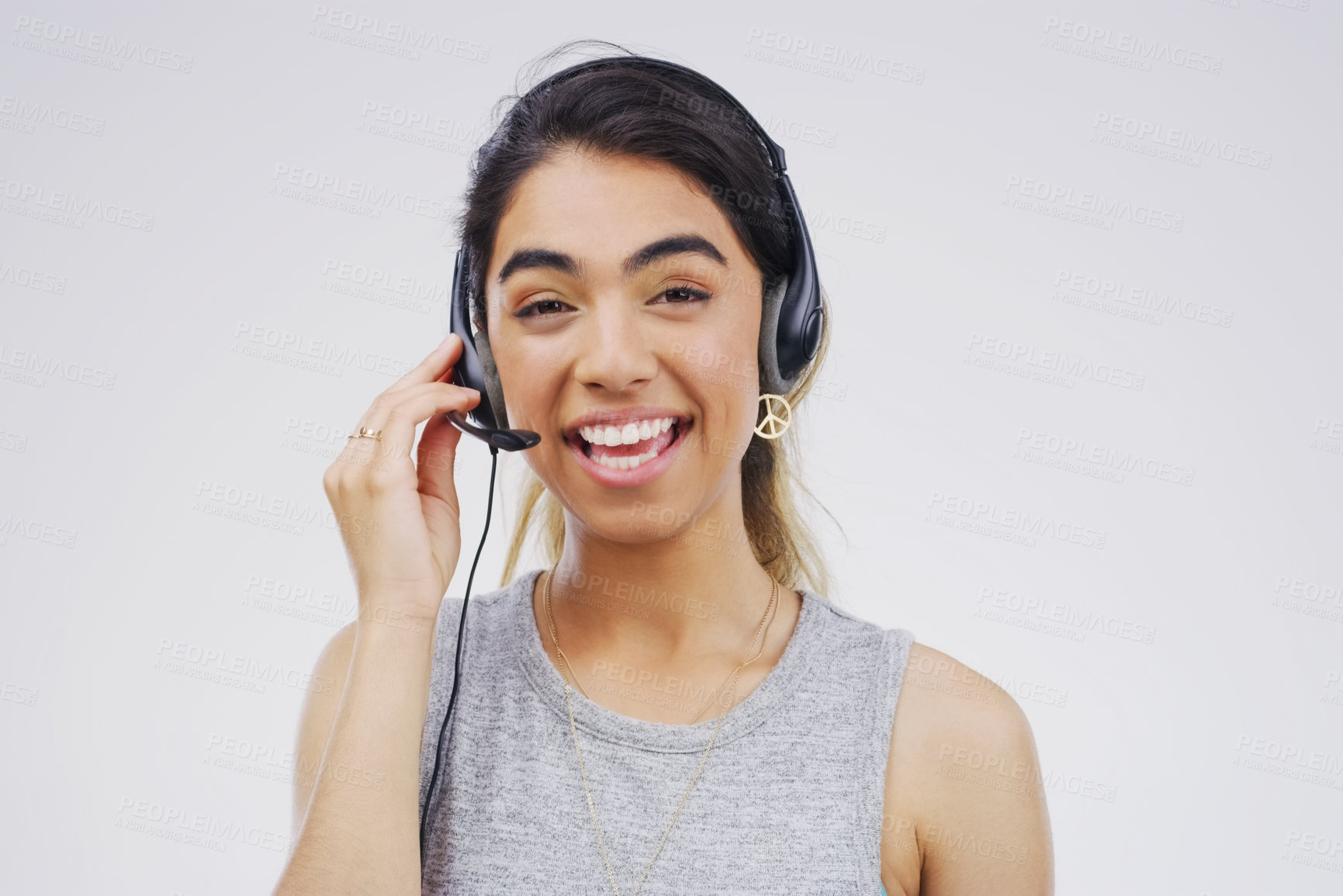 Buy stock photo Portrait, woman and headset for call centre, communication and smile by white background. Gen z, female person and happiness with microphone for talking, crm agent and virtual assistant in studio 