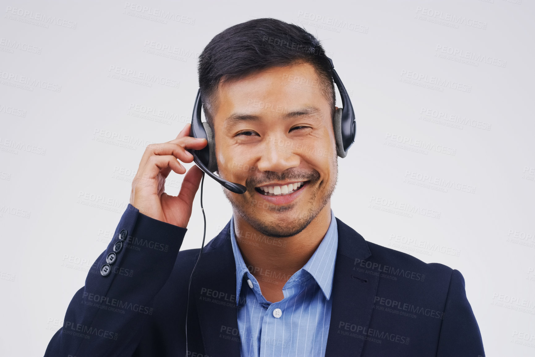 Buy stock photo Asian man, thinking and call center in studio with smile, headset and happy on white background. Male person, consultant and advisor for support, information and crm with mic for communication