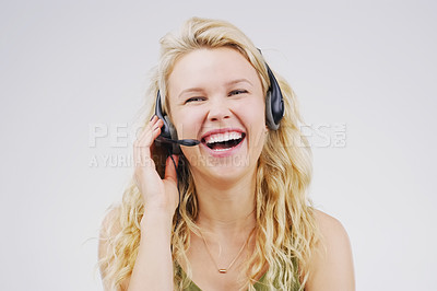 Buy stock photo Call center, woman and laugh in studio portrait with headset, smile and excited for tech support by backdrop. Funny agent, telemarketing and customer service with mic, voip and happy for consulting