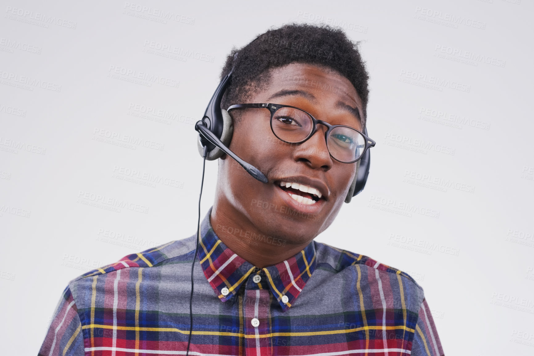 Buy stock photo African man, portrait and white background with headphones for customer service or call center, smile for communication. Male person, studio and microphone with happiness for chat or telemarketing