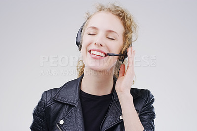 Buy stock photo Call center, woman and listen in studio with headset, smile and communication for tech support by white background. Crm girl, telemarketing and customer service with mic, voip or happy for consulting