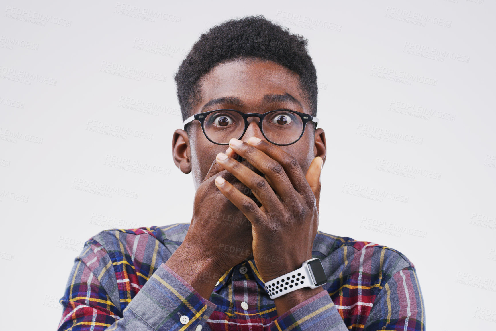 Buy stock photo Studio shot of a young man looking shocked against a grey background