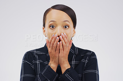 Buy stock photo Studio shot of a young woman looking shocked against a grey background