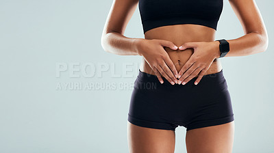 Buy stock photo Heart, hands and stomach of woman in studio for digestion, wellness and gut health. Mockup space, balance and nutrition with body of person on white background for diet, weight loss and slimming