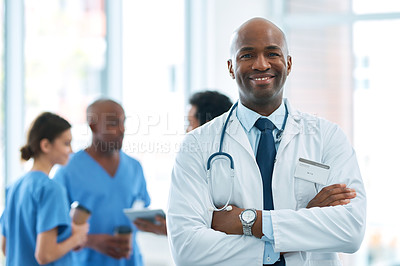 Buy stock photo Man, leader and portrait of doctor in hospital, healthcare or clinic with medical expert nurses to trust in quality care. Black person, medicine and happy neurosurgeon, arms crossed or confidence