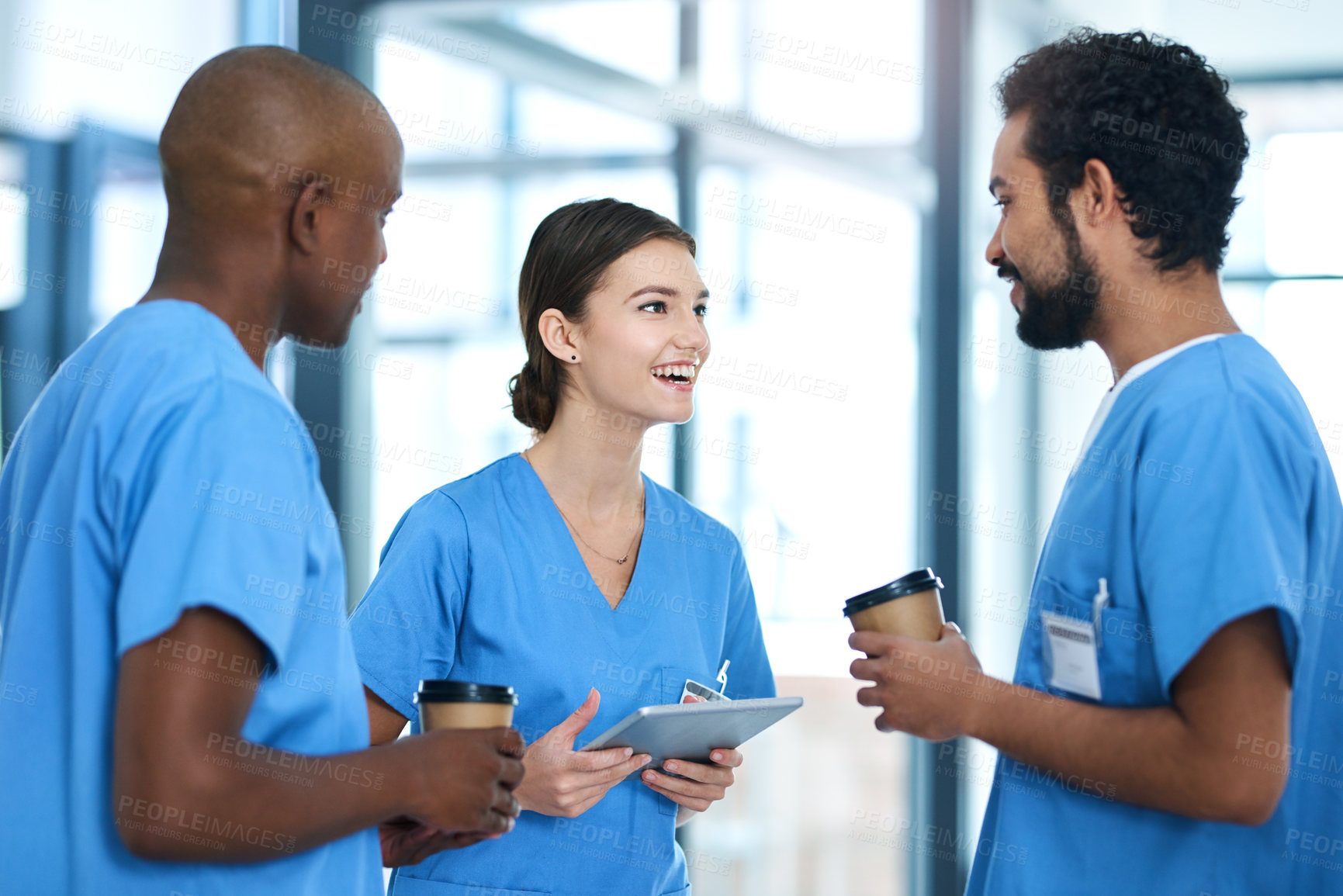 Buy stock photo Medical, people and staff discussion in hospital, tablet and conversation for health research with nurse interns together. Talking, report and happy or professional employees, wellness and teamwork